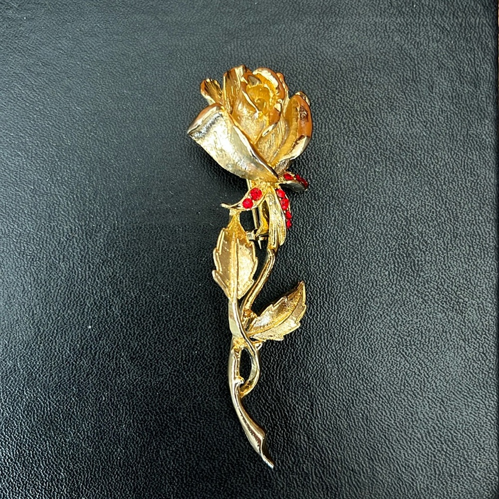 Gold Tone Rose Brooch With Red Rhinestones